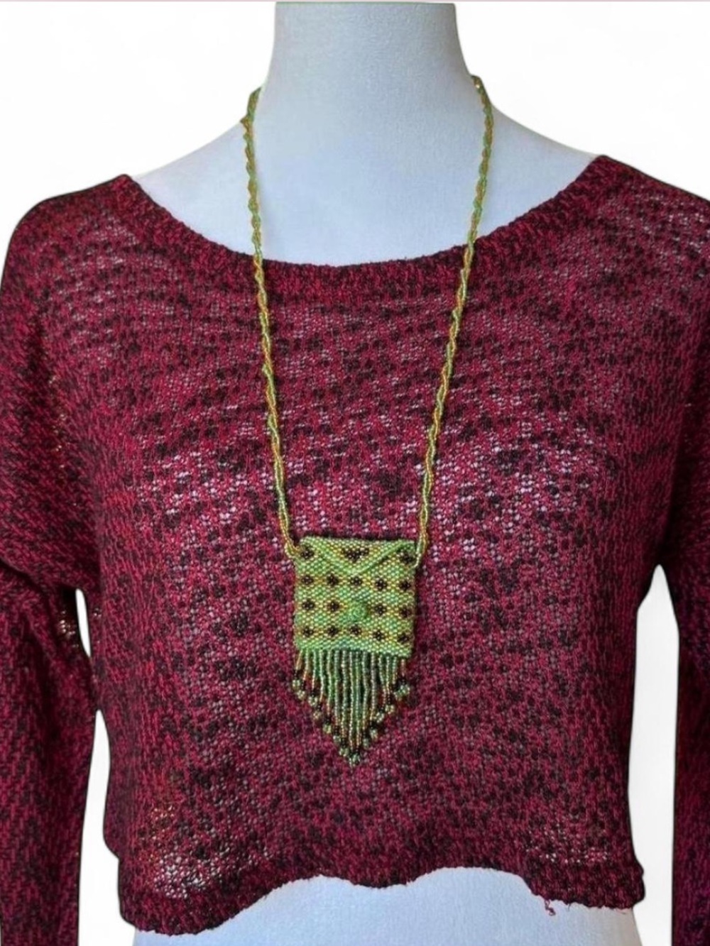Y2k beaded green pouch and multi-colored lipstick necklaces with tassel fringe.